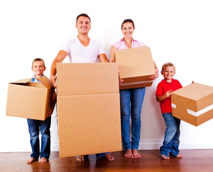 Professional movers handling office equipment